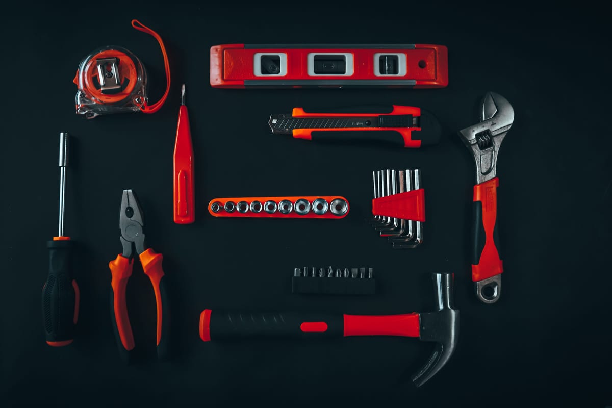 Hand tools arranged on a work surface