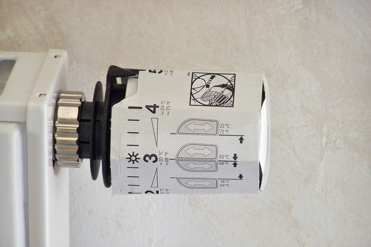 A thermostatic radiator valve with a protective cardboard cover