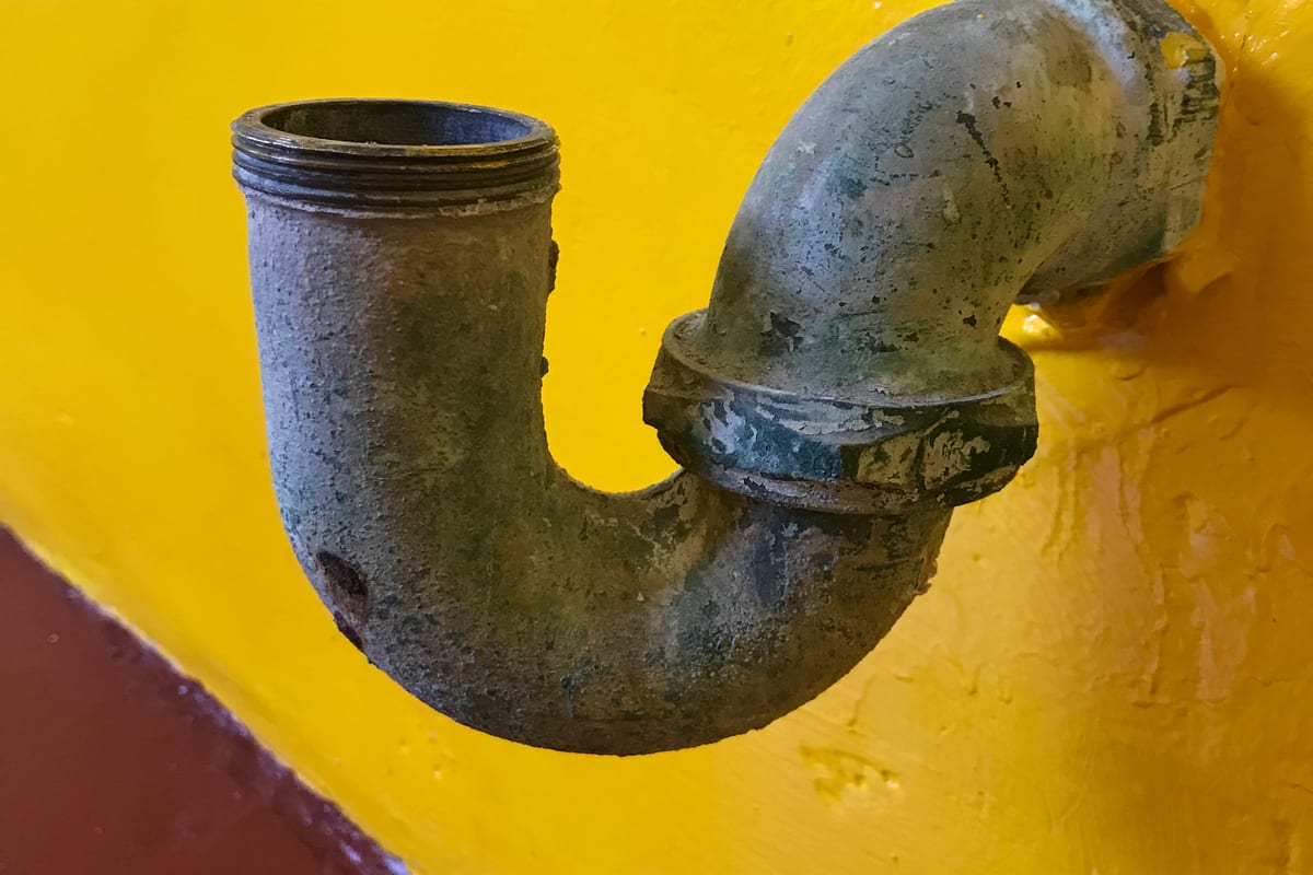 A sink trap and accessible waste pipe